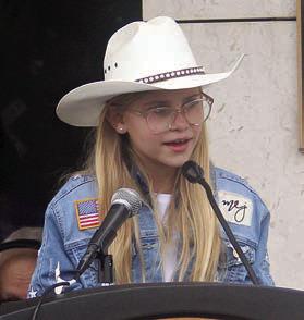 MARLEY VASEK sings “God Bless America.” Sticker Photo By Darrell Vyvjala