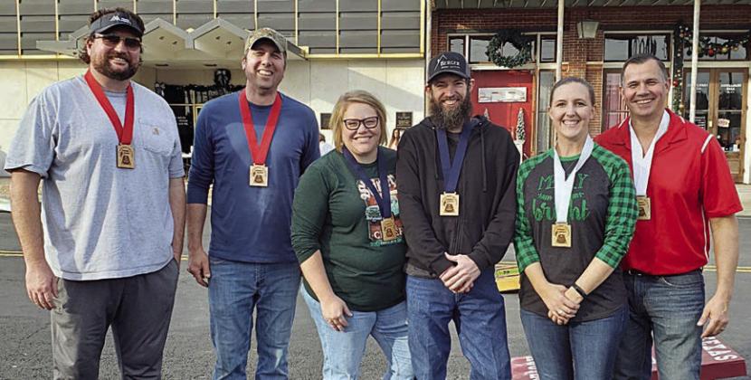 CORNHOLE WINNERS: (from left) Sean McCourt and Paddy Magliolo, second place; Kelly and Kenny Berger, first place; and Megan and Kevin Bartos, third place.