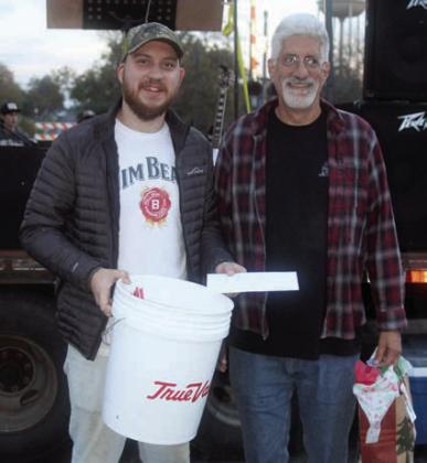 OVERALL CHAMPION &amp; CHILI COOKOFF, FIRST PL ACE: “ROCK THE LADLE ” – (from left) Anthony and Mike Horak. Other team members: Natalie and Christina Horak. Sticker Photo By Darrell Vyvjala