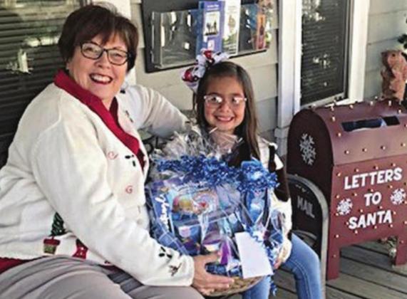 Gift Basket Winner - Zailynne Manzano, shown with Terri Wagner (left), Chamber executive director.