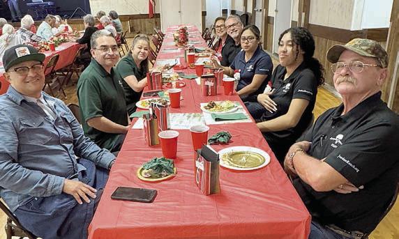 The team from Jordan Ranch (seated at right) makes the Senior Connections events extra special, including the holiday gathering.