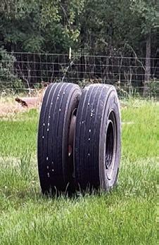 18-wheeler loses tire assembly which causes damage
