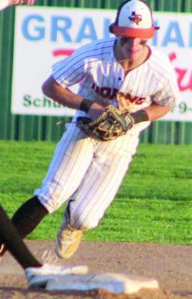 Cooper Demel fields an Indian grounder behind second base before turning a double play. Sticker Photo By Darrell Vyvjala