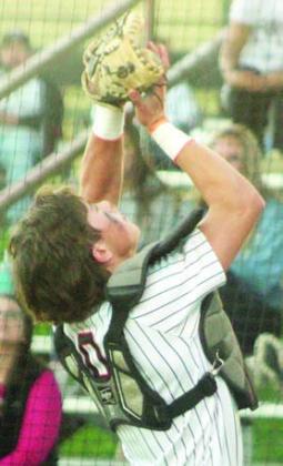 Catcher Jayse Janda gathers in a Ganado popup near the backstop. Sticker Photo By Darrell Vyvjala