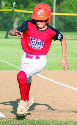 Reece Blansitt rounds third base on his way home for TC’s first run in the top of the first inning. Sticker Photo By Darrell Vyvjala