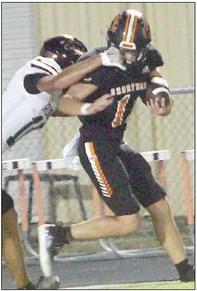 Jayse Janda gets a tug to his facemask on an 11-yard reception in the third quarter. Sticker Photo By Layne Vyvjala
