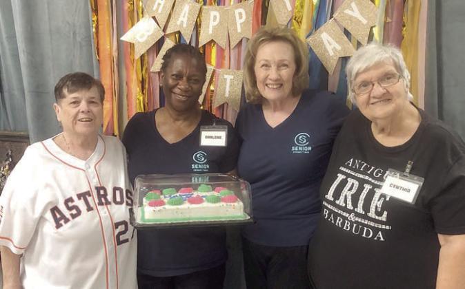 August birthdays honorees at Senior Connections included (from left) Julie Hill, Darlene Williams, Sharon Rodriguez and Cynthia Meyer. The cake was donated by Sandy Anderson and True Care Living in Columbus
