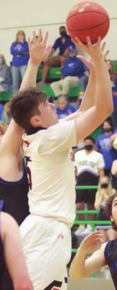 Jayson Schaefer scores after an offensive rebound late in the third quarter. Sticker Photo By Layne Vyvjala