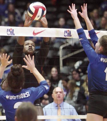 Jessalyn Gipson gets a tip past a pair of Trojanettes in game two. Sticker Photo By Layne Vyvjala