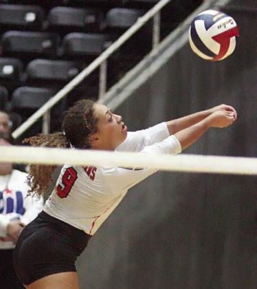 Kieryn Adams reaches for a dig in the fourth set. Sticker Photo By Layne Vyvjala
