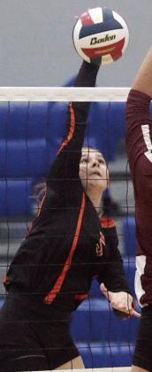 Haylee Vacek sends down a kill in the second set. Sticker Photo By Darrell Vyvjala