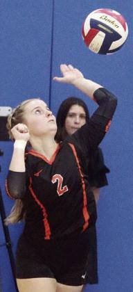Madison Kunschick serves one of her two aces in game two. Sticker Photo By Darrell Vyvjala