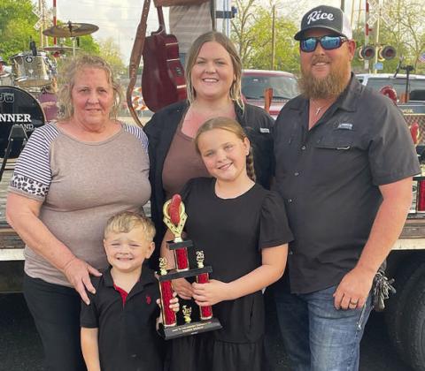 “BURNT PIG” – 3RD PLACE SMOKED SAUSAGE / 3RD PLACE FRESH SAUSAGE – (front, from left) Jace and Ember Machart; (back, from left) Jill Machart, Juanita Stancik, and Justin Machart. Sticker Photo By Darrell Vyvjala