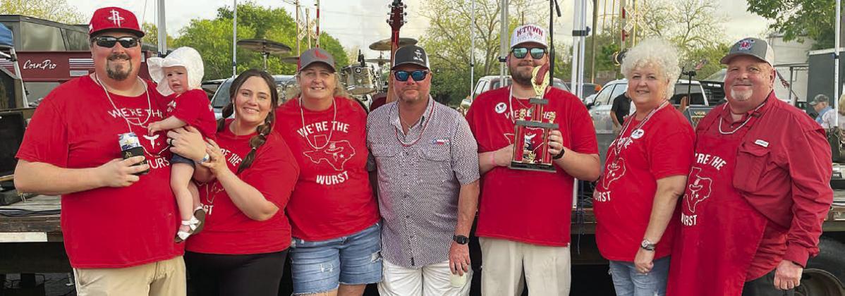 “WE’RE THE WURST” – 3RD PLACE DRY SAUSAGE – (from left) Mason, Finley, and Allison Florus, Dawn and Brad Wenske, Brayson Florus, and Ann and Darren Florus. Sticker Photo By Darrell Vyvjala