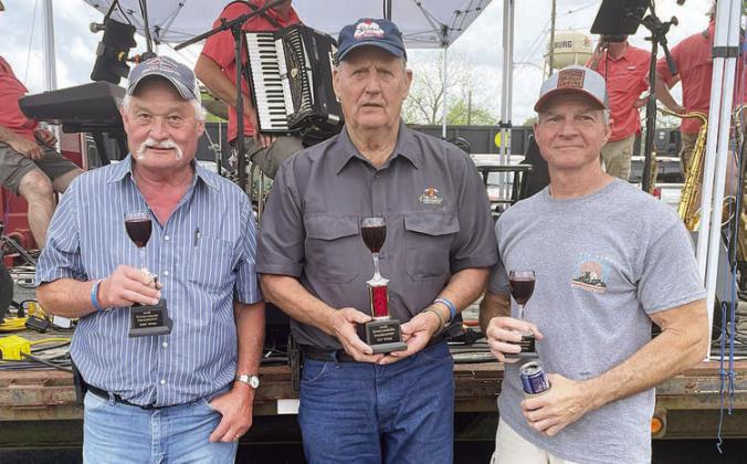 HOMEMADE WINE CONTEST – (from left) James Kubecka, second place; Henry Kutac, first place; and Albert Srubar, third place. Sticker Photo By Darrell Vyvjala