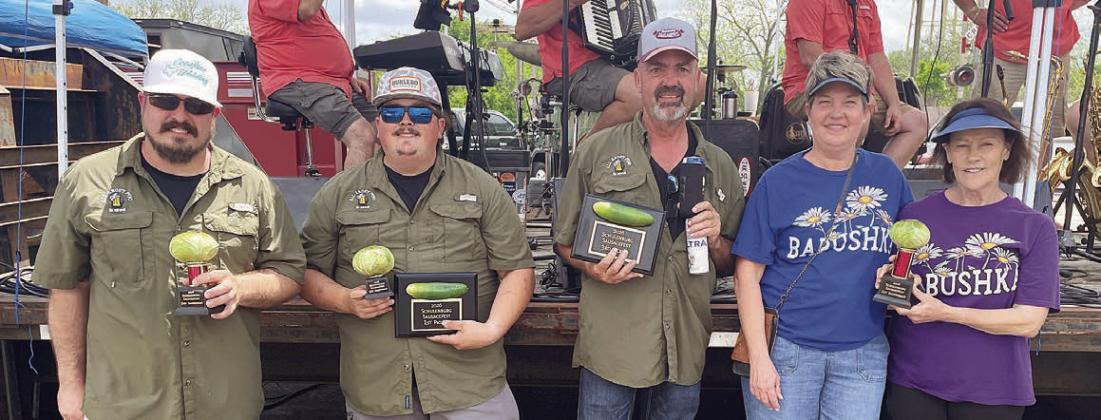 HOMEMADE SAUERKRAUT CONTEST – (from left) Ben Zahradnik, Adrian Celedon, and Jeff Orsak (“All About Pivo”), second and third places; and Tami Harrell and Kelly Perry (“Bohemian Babushkas”), first place. Sticker Photo By Darrell Vyvjala