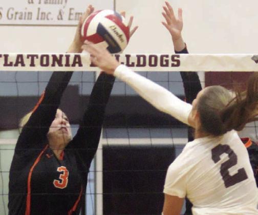 Reagan Dusek rejects Summer Sodek’s attack in the third set Saturday. Sticker Photo By Darrell Vyvjala
