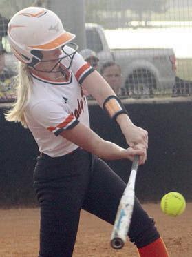 Olivia Mathis connects for an RBIsingle in the bottom of the second inning in game one. Sticker Photo By Darrell Vyvjala