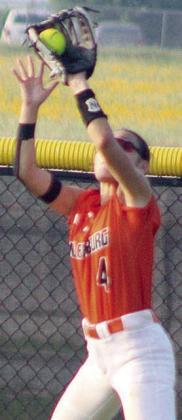 Centerfielder Rilee Sanchez goes up to snag a fly ball for the second out in the bottom of the third inning in game two. Sticker Photo By Darrell Vyvjala