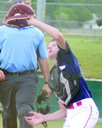 Catcher Holden Holub secures a popup in foul territory in the bottom of the second inning last Wednesday. Sticker Photo By Darrell Vyvjala