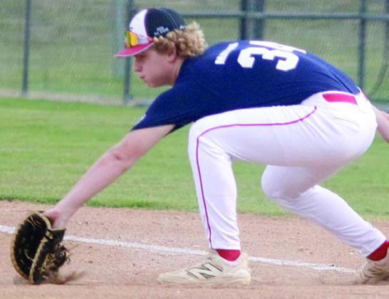 Colton Matura scoops a throw in the dirt at first base during game two. Sticker Photo By Darrell Vyvjala