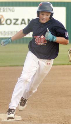 Will Herzik rounds third and heads home with a run in the top of the fourth inning of game one. Sticker Photo By Darrell Vyvjala