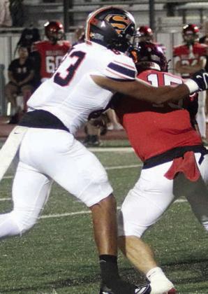 Jayvan Luhrs gets to Cody Sells for a third-down sack early in the second quarter. Sticker Photo By Layne Vyvjala