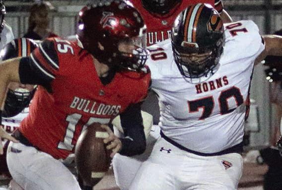 Marshall Wellborn flushes Cody Sells from the pocket in the first half. Sticker Photo By Layne Vyvjala