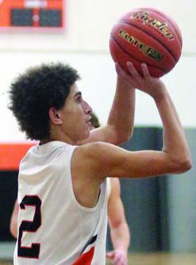 Denver Carr lines up a game-tying trey in the fourth period Friday. Sticker Photo By Darrell Vyvjala