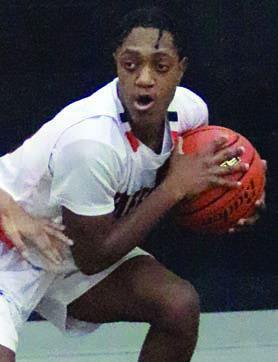 Demarrion Glass secures a theft in the third quarter of last week’s home game. Sticker Photo By Darrell Vyvjala