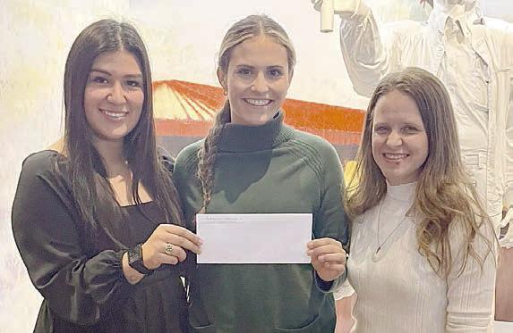Grant pr esentation to Turt le Wing Foundation – (from left) Melanie Ramirez, representing Stanzel Family Foundation; Destiny Siptak, Turtle Wing executive director; and Cheryl Pekar, representing Stanzel Family Foundation.