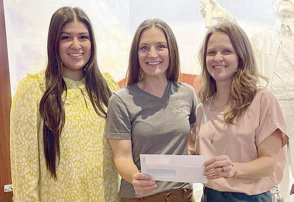 Grant pr esentation to And Then a New Day – (from left) Melanie Ramirez, representing Stanzel Family Foundation; Erin Wotipka, representing And Then; and Cheryl Pekar, representing Stanzel Family Foundation.