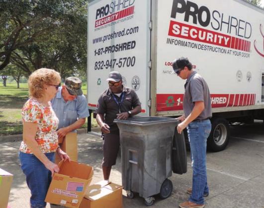 2019 Shred Day LEFT photo – CVTC’s Hunter Hengst and ProShred’s Terry McCoy assist Lloyd and Diane Goedrich with the boxes of documents that they brought to the 2019 document Shred Day.