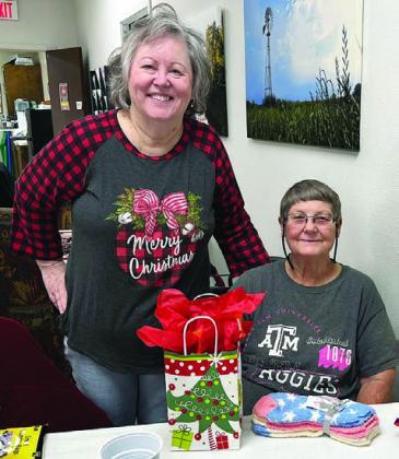 Bingo winner JoNell Vacek (right) with Vicki Woodard (left), who donated a new bingo set and called bingo.