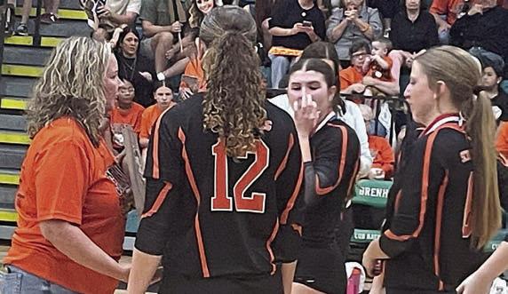 Seniors (from right) Clara Magliolo, Landry Zapalac, and Grace Schramek, along with Reagan Dusek (not shown), accept the state semifinal trophy from High School Principal Callene Zapalac. Sticker Photo By Darrell Vyvjala