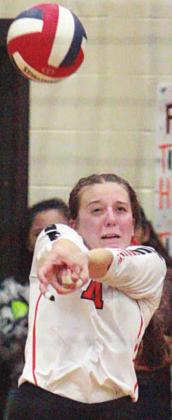 Mackenzie Kunschick digs a Thorndale attack in the fifth set. Sticker Photos By Darrell Vyvjala