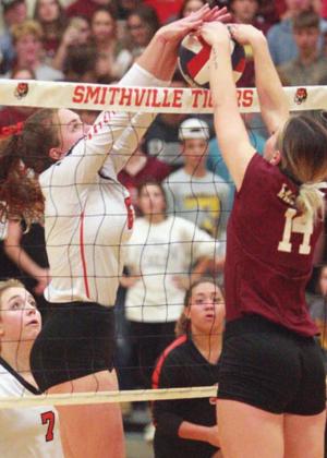 Tamara Otto (left) battles Kyndal Robinson for a 50/50 ball at the net in game three. Sticker Photo By Darrell Vyvjala