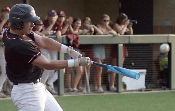Aaron Janecek sends a double to left-centerfield in the top of the first inning, when he scored the game’s only run. Sticker Photo By Darrell Vyvjala