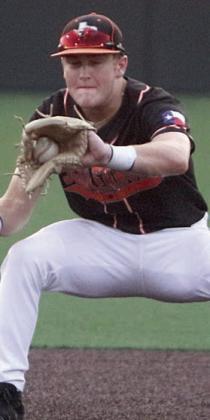 Shortstop Reid Janda fields a grounder to start a double play in the third. Sticker Photo By Darrell Vyvjala