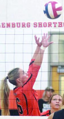Jenna Guentert sets up Greenli VanZandt for the final point of the win over Fayetteville. Sticker Photo By Darrell Vyvjala