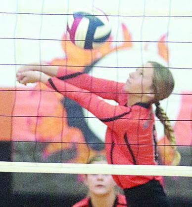 Michaela Kollmann gets to a Lady Lions attack during Thursday morning’s match. Sticker Photo By Darrell Vyvjala