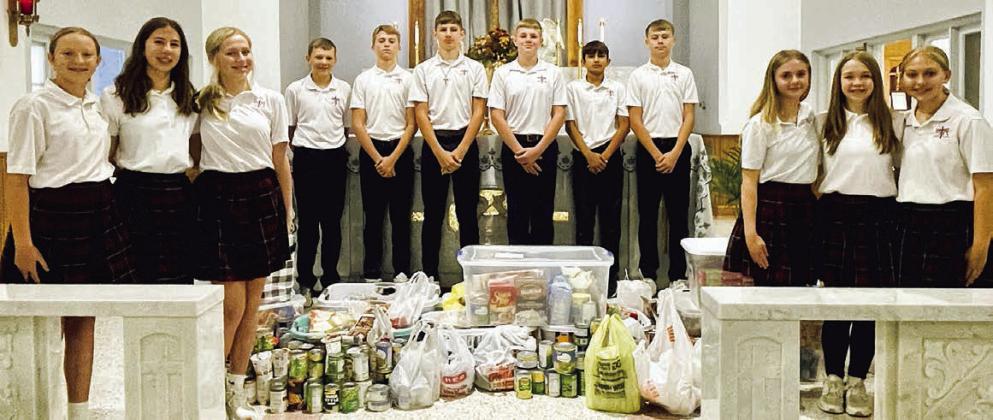 St. Rose collects for Family Crisis Center, SaFP at Thanksgiving Mass
