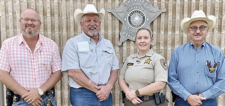 Holly Smith (second from right) has been appointed as the first female jail administrator for Fayette County. She is shown with (from left) Lt. David Beyer, Sheriff Keith Korenek and (right) Chief Deputy Randy Noviskie.