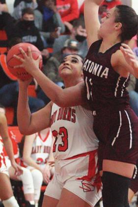 Airyanna Rodriguez scores under the basket to put the Lady Horns up 32-12 in the third quarter against Flatonia. Sticker Photo By Darrell Vyvjala