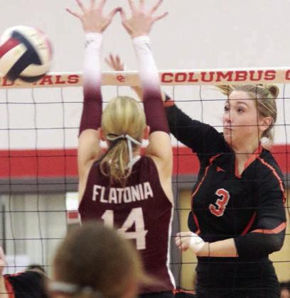 Reagan Dusek directs an attack cross-court for a point in the fourth set. Sticker Photo By Darrell Vyvjala