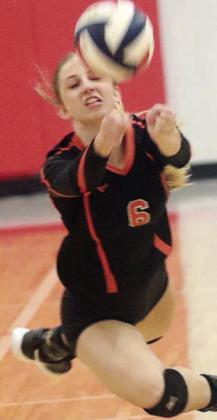Clara Magliolo makes a diving dig in set one. Sticker Photo By Darrell Vyvjala