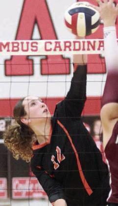 Grace Schramek sends over a kill in the second game. Sticker Photo By Darrell Vyvjala
