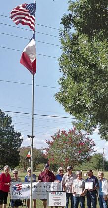Eddie and Debra Hernandez, 1616 Montezuma St., Columbus, were selected by the DAR/SAR for September recognition for display of the American flag. Honorees and organization representatives shown are (from left) Donna Pustejovsky, Nelma Strey, Marti Herring, Vernon and Connie Dittrich, Dave Zachmeyer, Debra and Eddie Hernandez and Judy Zachmeyer.