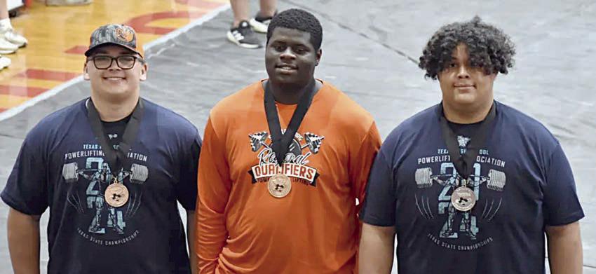 Shown with their medals at the regional powerlifting meet are (from left) Marshall Wellborn, Ricky Walton, and Calvin Thompson.