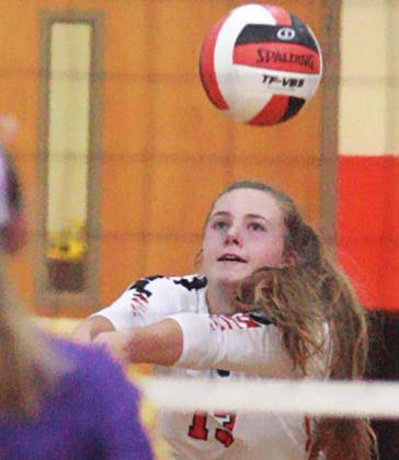 Regan Lux picks up a dig in game two of the Lady Horns’ win last Friday. Sticker Photo By Darrell Vyvjala